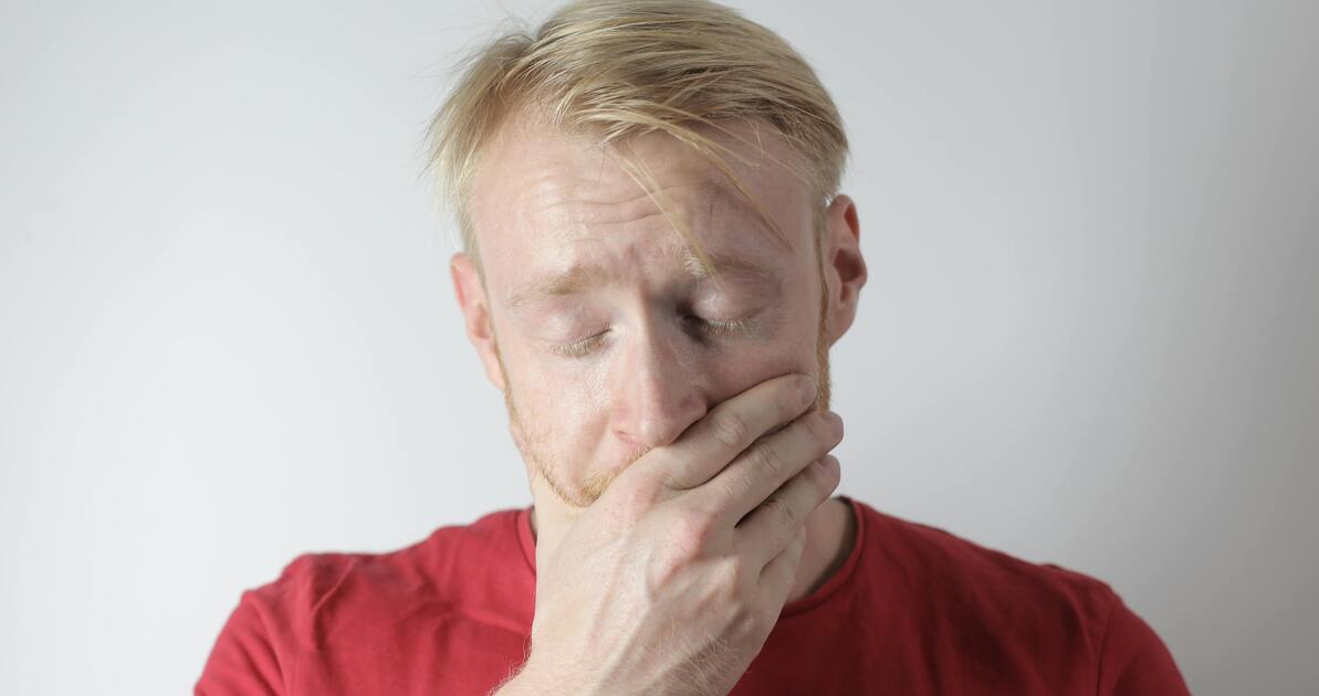 A person looking tired and overwhelmed