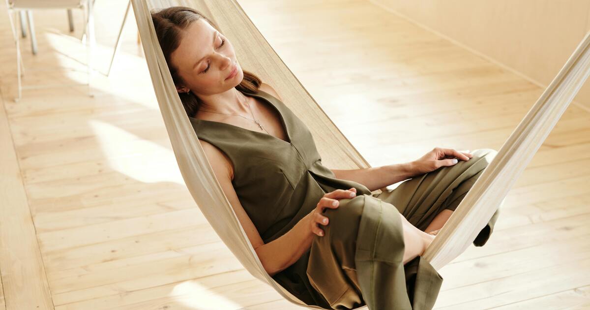 A calm lifestyle scene with a person relaxing in a peaceful environment, representing stress relief