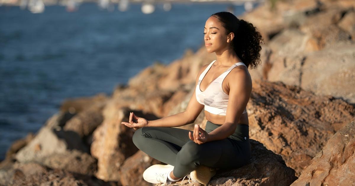 Person practicing deep breathing outdoors